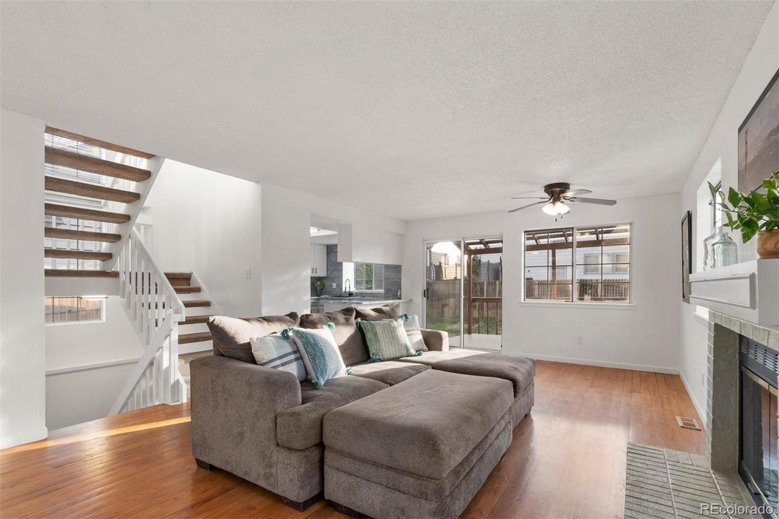 6283 Xavier Street Arvada, CO 80003 - Photo 5 of 36 a living room with furniture and wooden floor