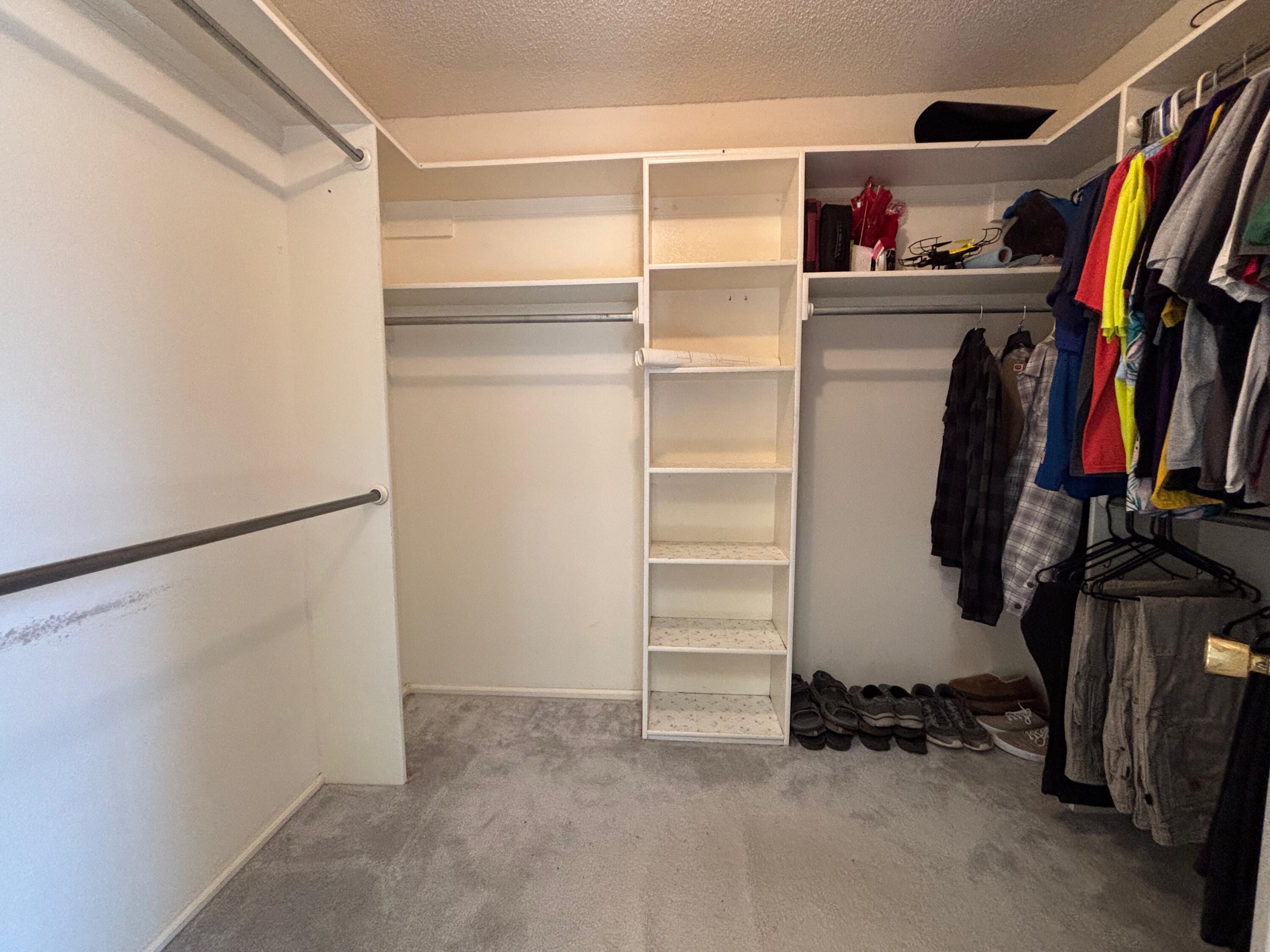 1502 Culpepper Avenue Wilson, TX 79381 - Photo 13 of 26 a view of walk in closet with clothes and shoes