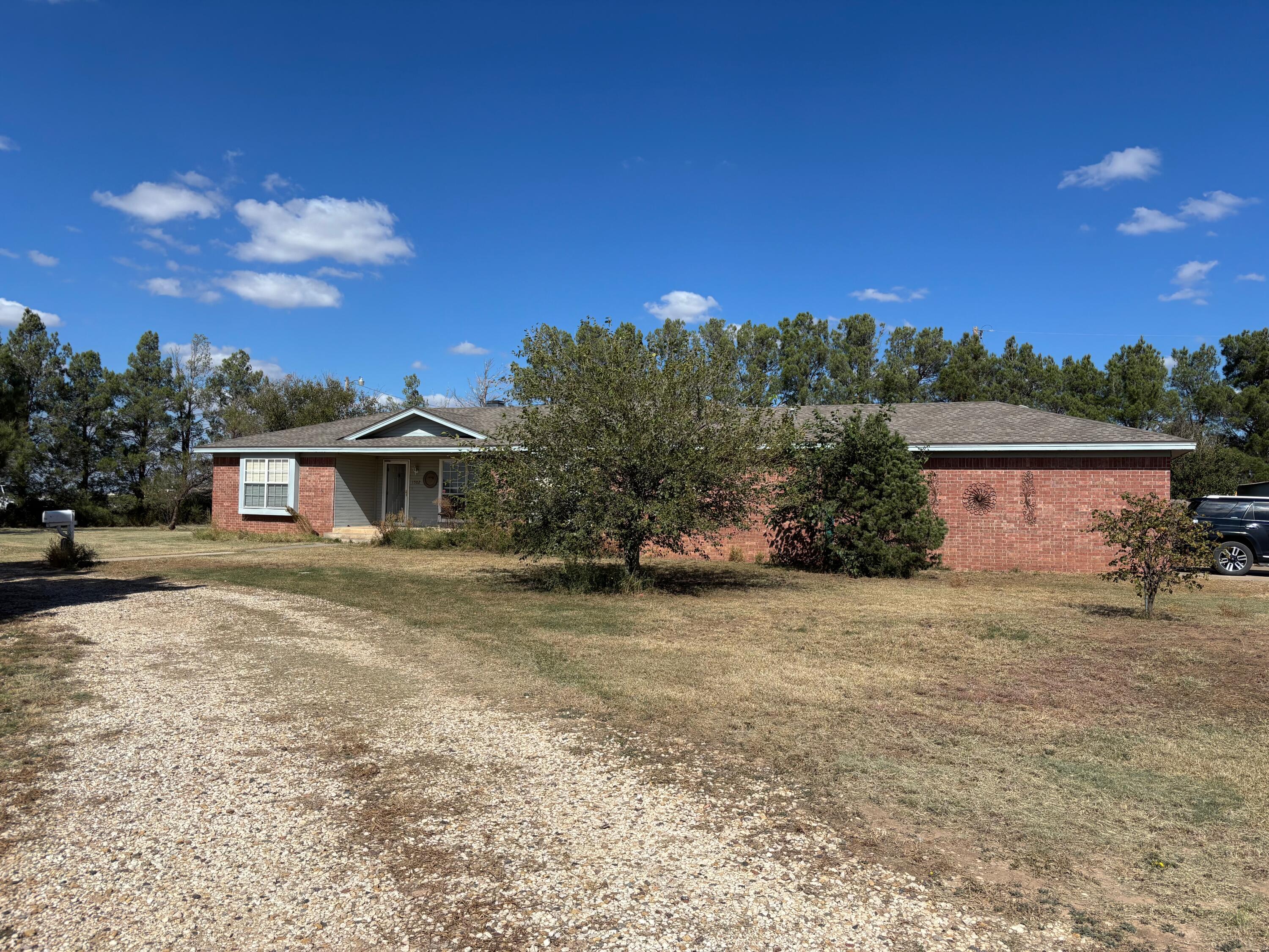 1502 Culpepper Avenue Wilson, TX 79381 - Photo 2 of 26 a view of a house with a yard