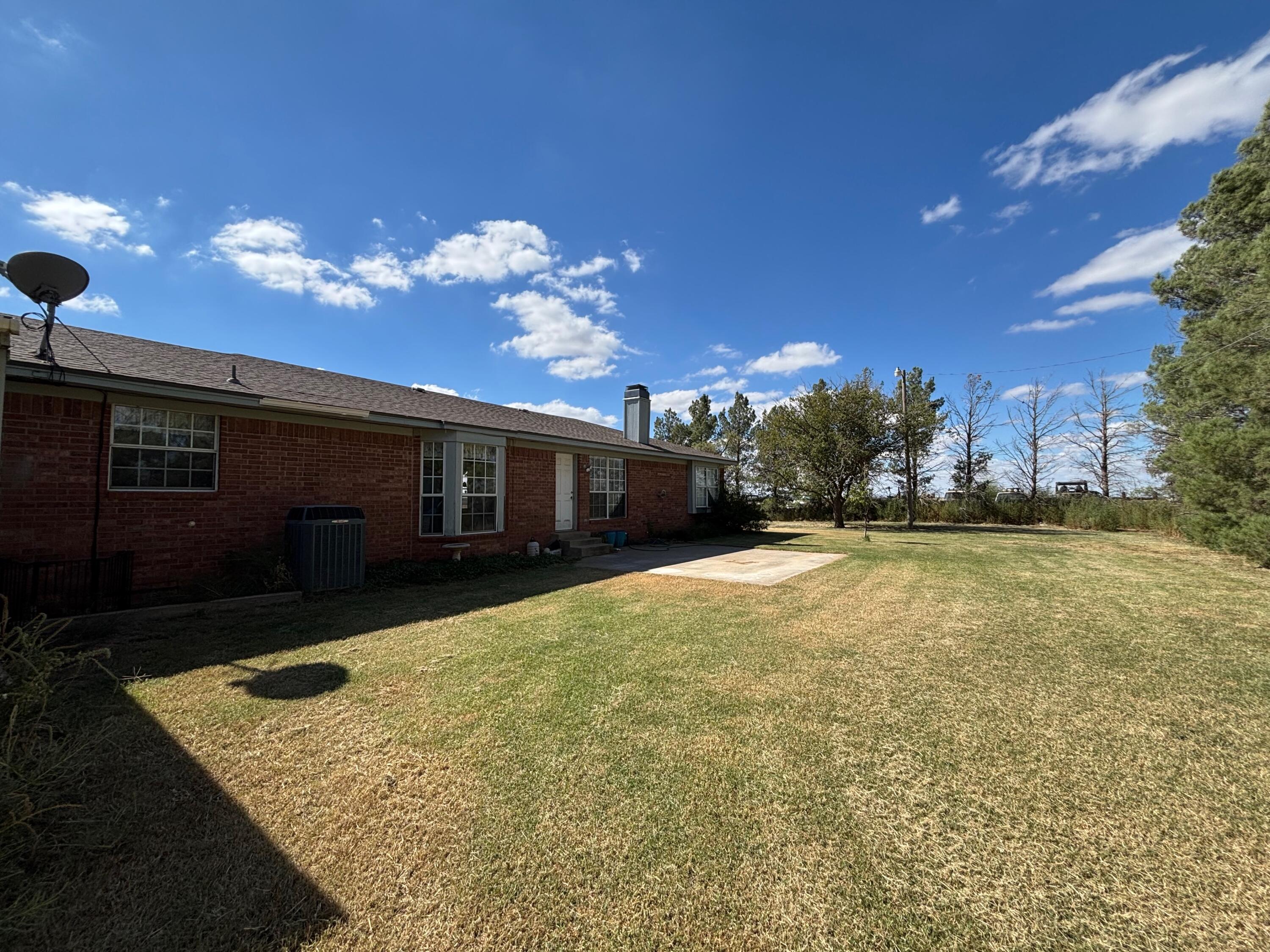 1502 Culpepper Avenue Wilson, TX 79381 - Photo 22 of 26 a view of a house with a yard