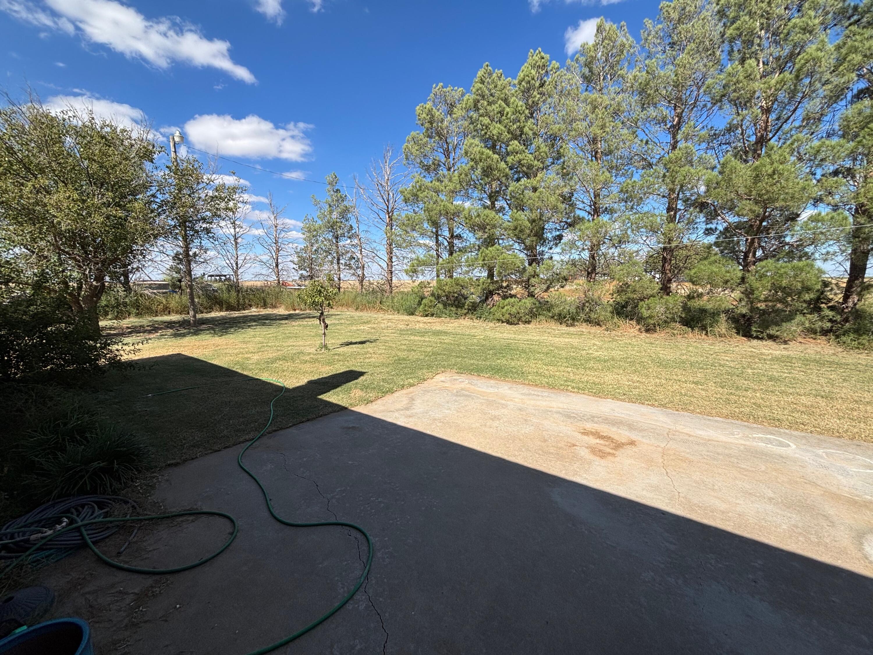 1502 Culpepper Avenue Wilson, TX 79381 - Photo 23 of 26 a view of a swimming pool with an outdoor space and seating area