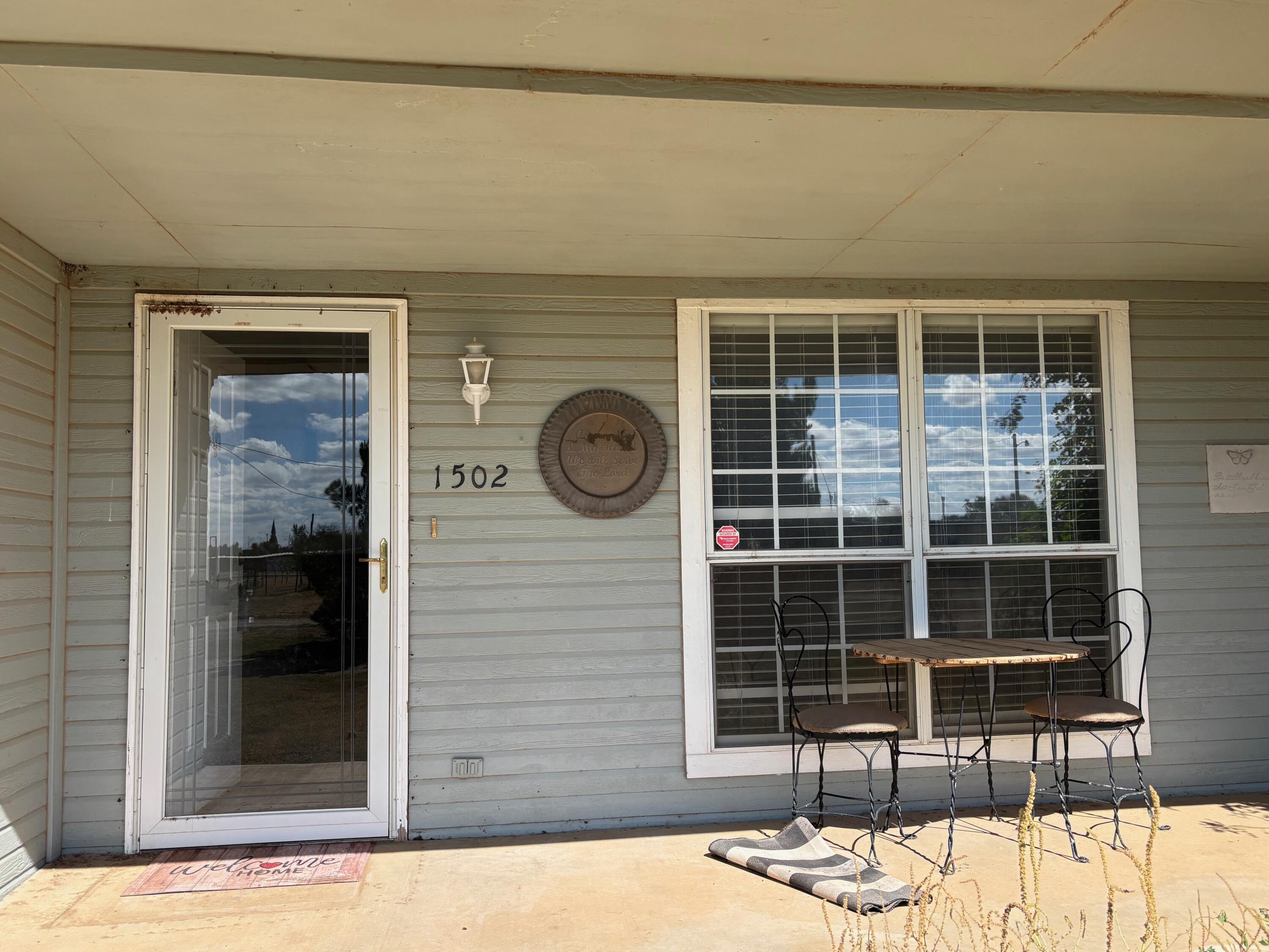 1502 Culpepper Avenue Wilson, TX 79381 - Photo 3 of 26 a front view of a house with a yard