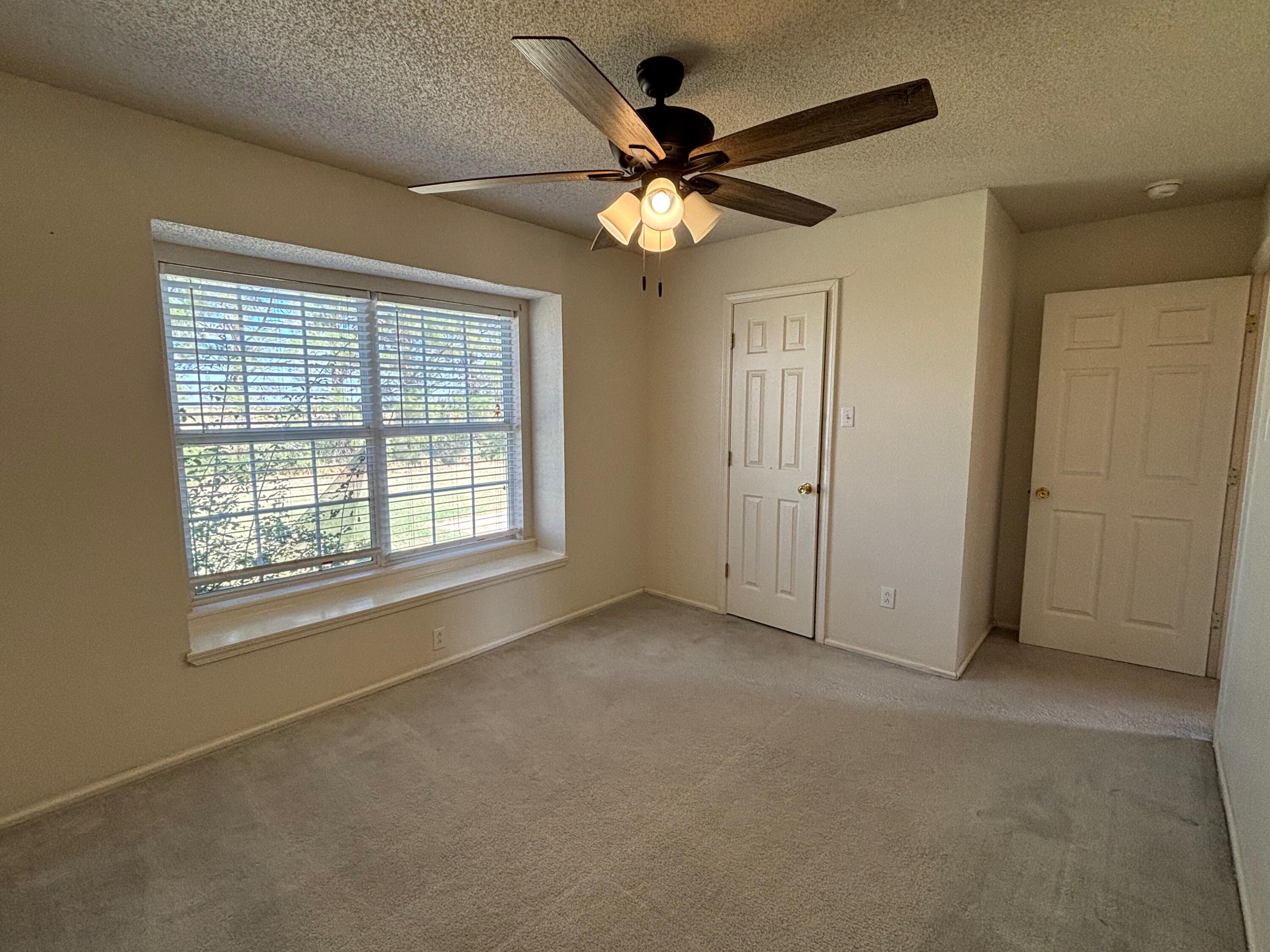 1502 Culpepper Avenue Wilson, TX 79381 - Photo 7 of 26 a view of an empty room with a window