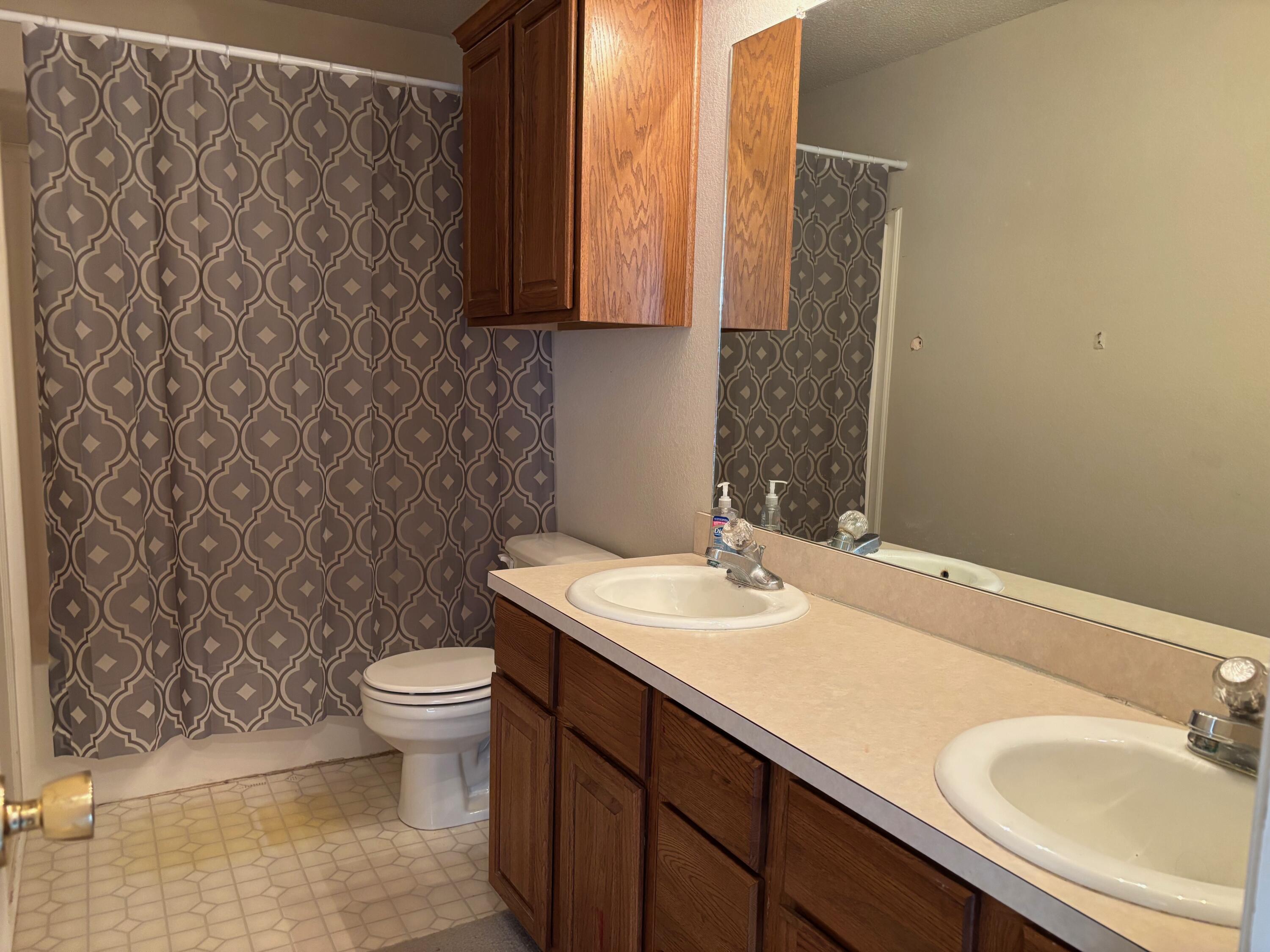 1502 Culpepper Avenue Wilson, TX 79381 - Photo 8 of 26 a bathroom with a sink and a toilet