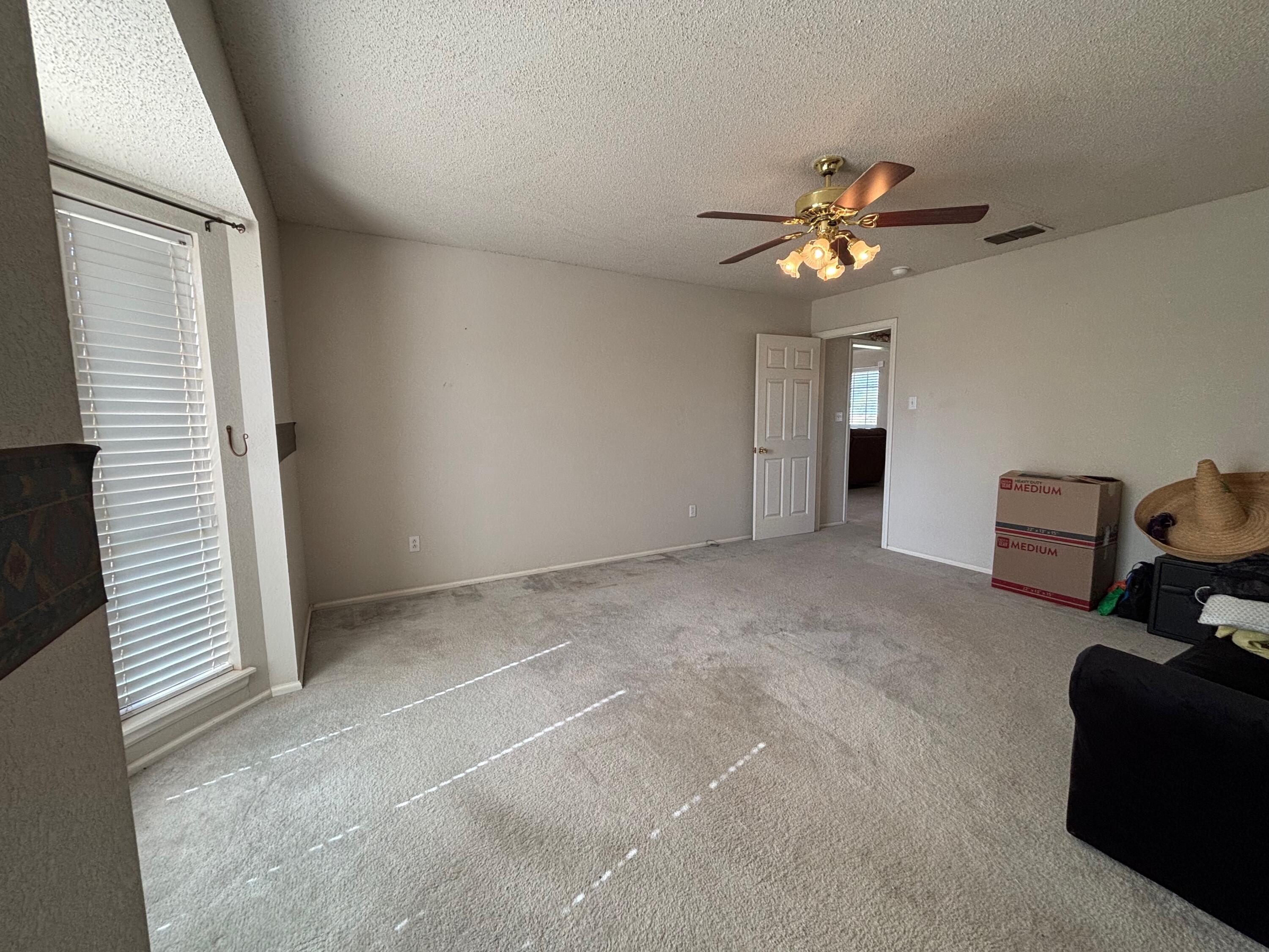 1502 Culpepper Avenue Wilson, TX 79381 - Photo 10 of 26 a view of workspace with a ceiling fan and a window