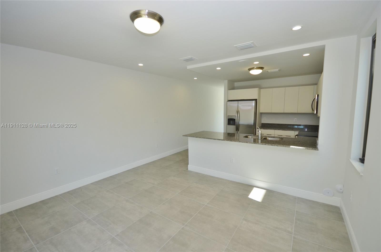 4374 East 10th Avenue, Unit 4374 Hialeah, FL 33013 - Photo 13 of 29 a view of a room with stainless steel appliances