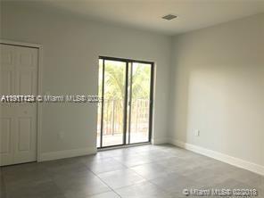 4374 East 10th Avenue, Unit 4374 Hialeah, FL 33013 - Photo 15 of 29 a view of an empty room with a window