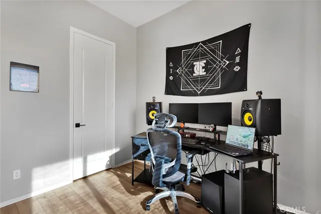 a workspace with furniture and painting on the wall