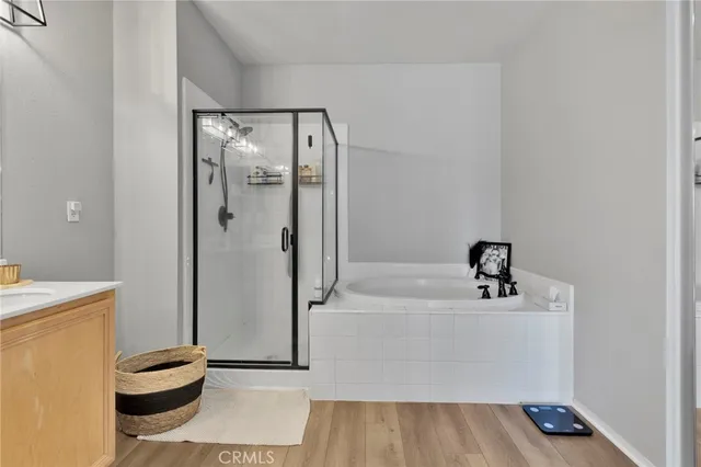 a bathroom with a bathtub and a shower