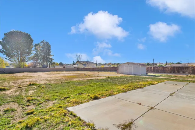 a view of balcony with wooden fence