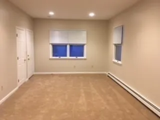 en empty room with windows