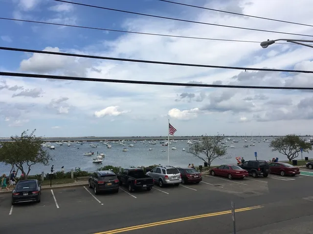 a view of a city street with cars
