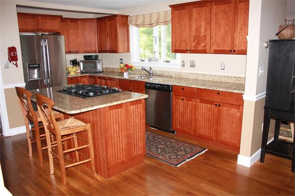 490 Brook Road Milton, MA 02186 - Photo 11 of 24 a kitchen with stainless steel appliances a stove a sink a microwave a refrigerator and cabinets
