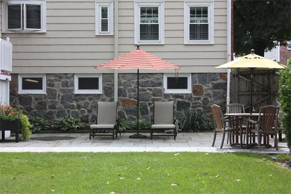 490 Brook Road Milton, MA 02186 - Photo 22 of 24 a view of a chair and table in backyard of the house