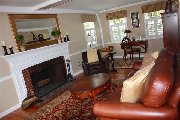 490 Brook Road Milton, MA 02186 - Photo 4 of 24 a living room with furniture a large window and a fireplace