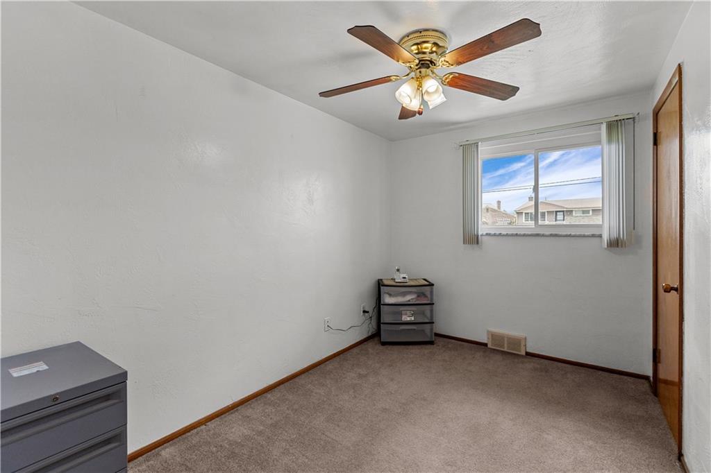 189 William Circle McKees Rocks, PA 15136 - Photo 13 of 24 an empty room with windows and fan