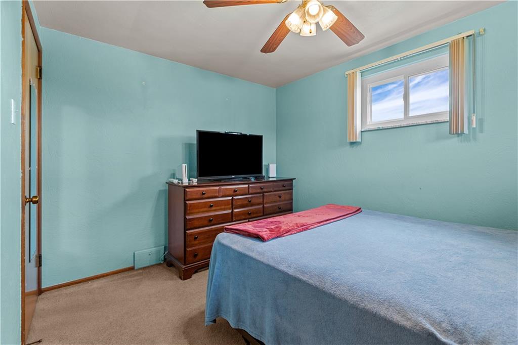 189 William Circle McKees Rocks, PA 15136 - Photo 19 of 24 a bedroom with a bed and a flat screen tv