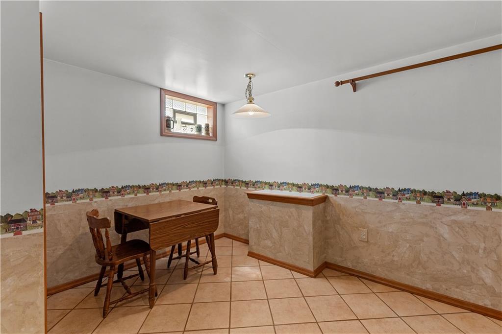 189 William Circle McKees Rocks, PA 15136 - Photo 22 of 24 a view of a dining room with furniture and a chandelier
