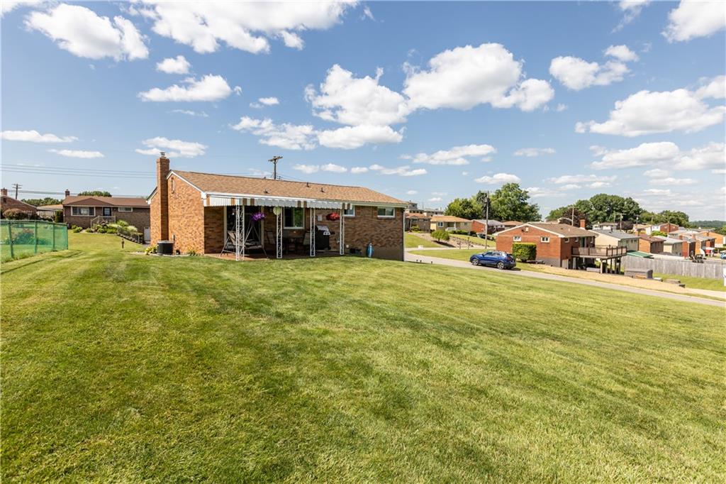 189 William Circle McKees Rocks, PA 15136 - Photo 5 of 24 a view of a house with a big yard