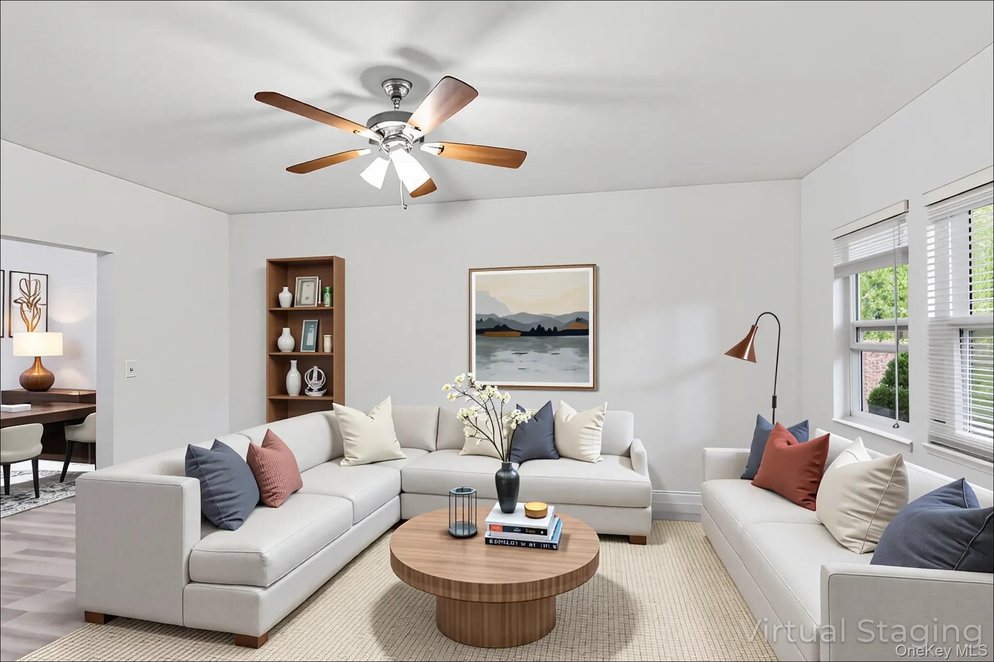 370 Blue Point Road Farmingville, NY 11738 - Photo 2 of 19 Living room featuring ceiling fan