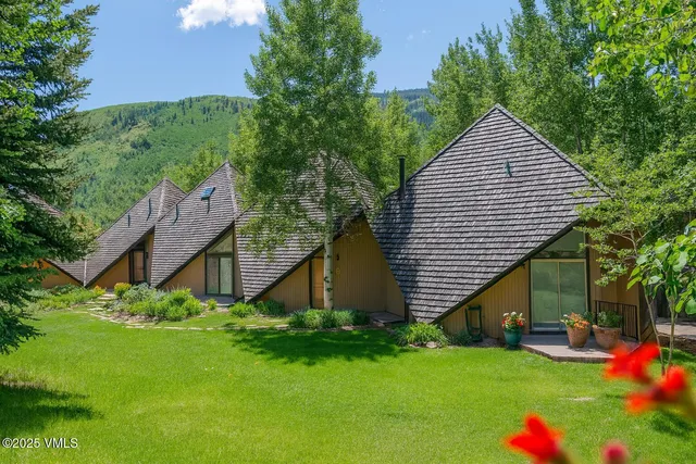 a backyard of a house with lots of green space