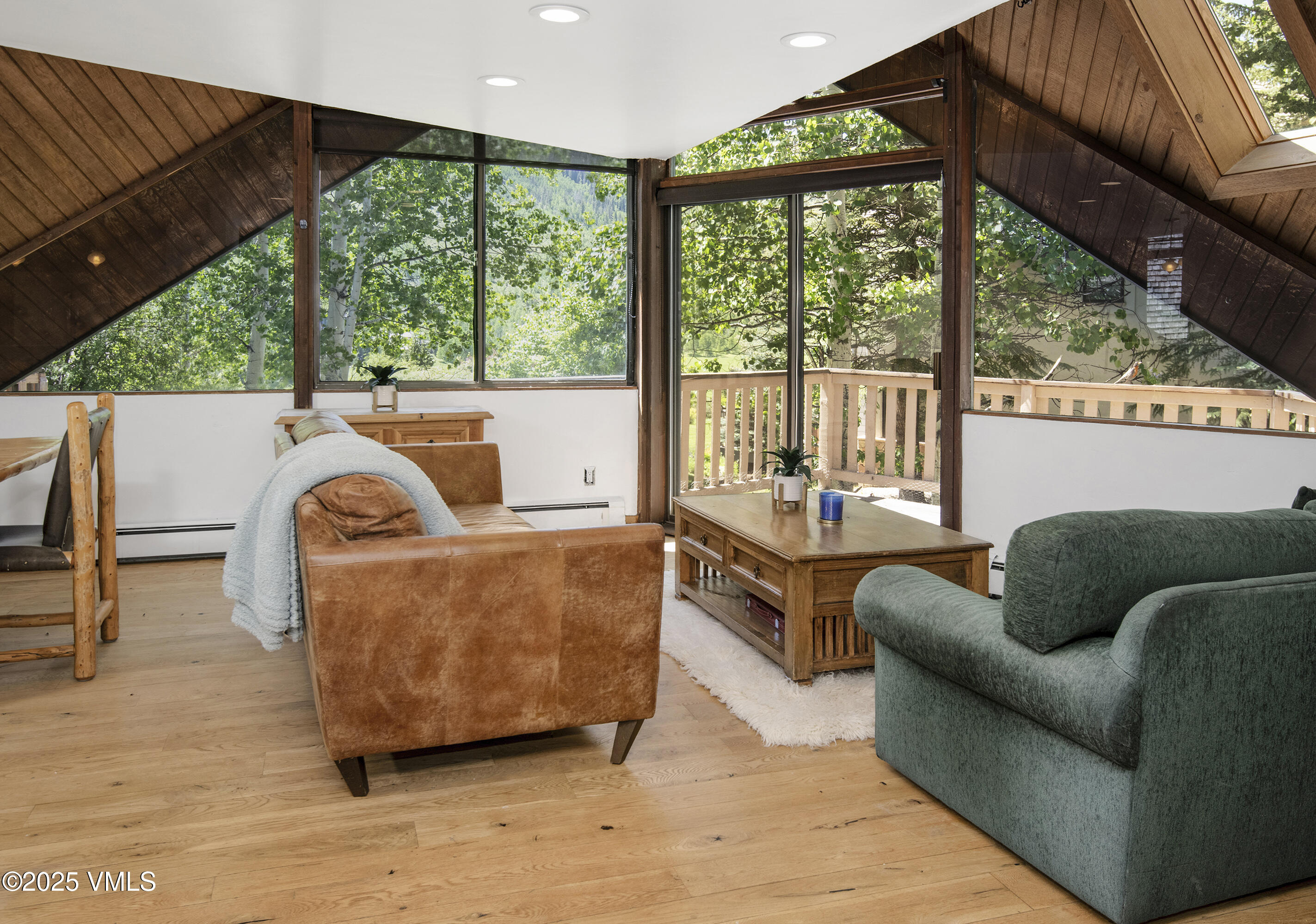 1400 Lions Ridge Loop, Unit A5 Vail, CO 81657 - Photo 4 of 32 a living room with furniture and a large window
