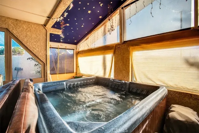 a bathroom with a bathtub and shower