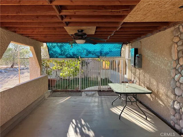 a bathroom with a sink a toilet and shower curtain