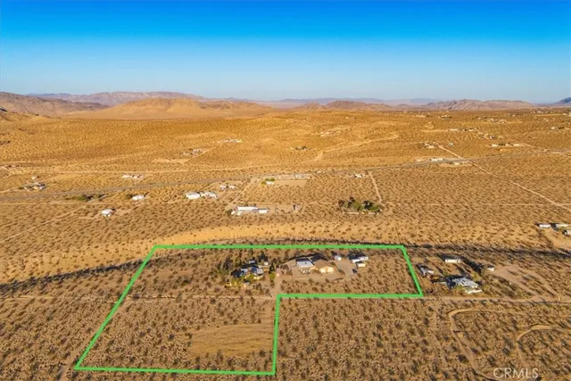 a house with trees in the background