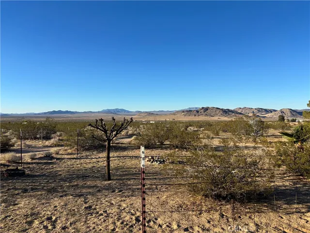 a view of a room with shelves and a window