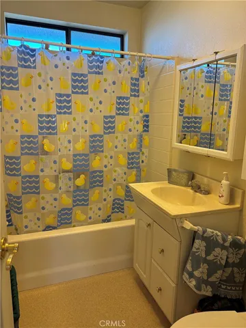 a view of a room with chair and wooden floor