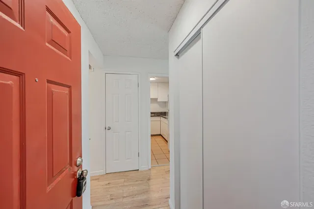 a view of entryway with wooden floor