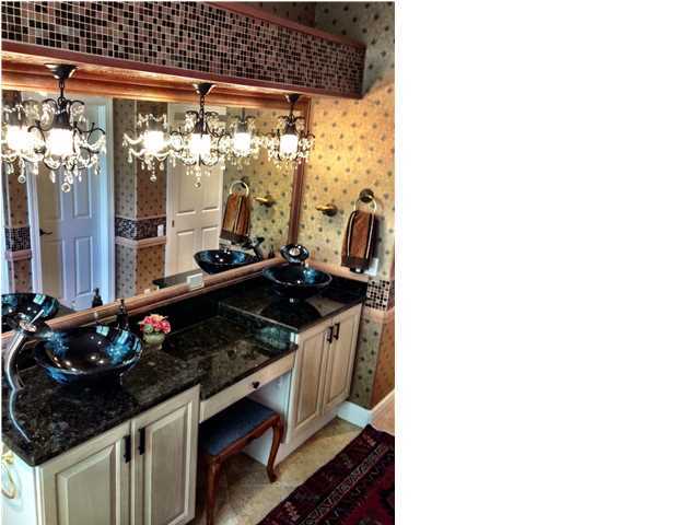 388 Shipwreck Road Santa Rosa Beach, FL 32459 - Photo 11 of 17 a kitchen with stainless steel appliances granite countertop a sink stove and refrigerator