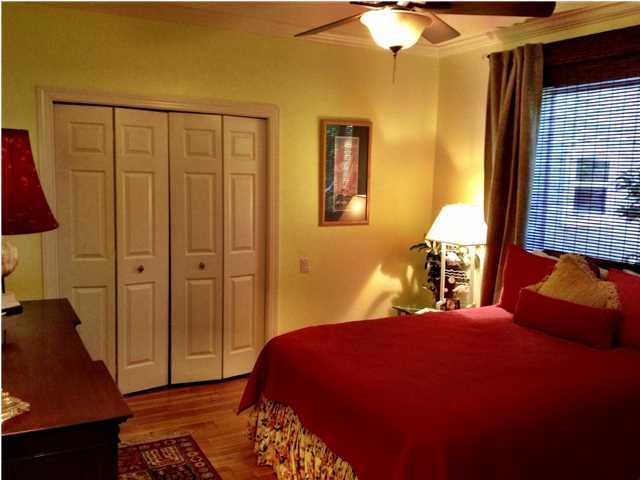 388 Shipwreck Road Santa Rosa Beach, FL 32459 - Photo 14 of 17 a bedroom with a bed and wooden floor