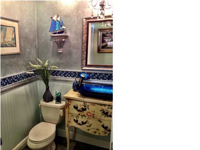 388 Shipwreck Road Santa Rosa Beach, FL 32459 - Photo 15 of 17 a bathroom with a toilet a sink and mirror