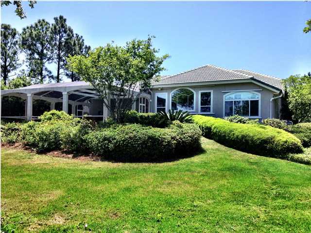 388 Shipwreck Road Santa Rosa Beach, FL 32459 - Photo 3 of 17 a front view of a house with a garden