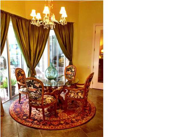 388 Shipwreck Road Santa Rosa Beach, FL 32459 - Photo 7 of 17 a view of a dining room with furniture and a chandelier