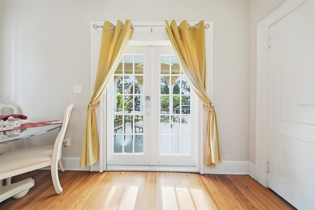 8334 Diagonal Road North St. Petersburg, FL 33702 - Photo 13 of 57 a view of a bedroom with wooden floor and windows