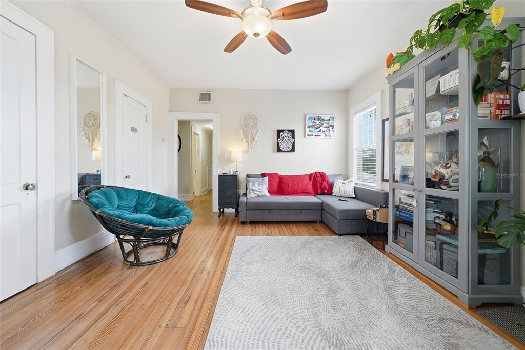8334 Diagonal Road North St. Petersburg, FL 33702 - Photo 27 of 57 a living room with furniture and a wooden floor
