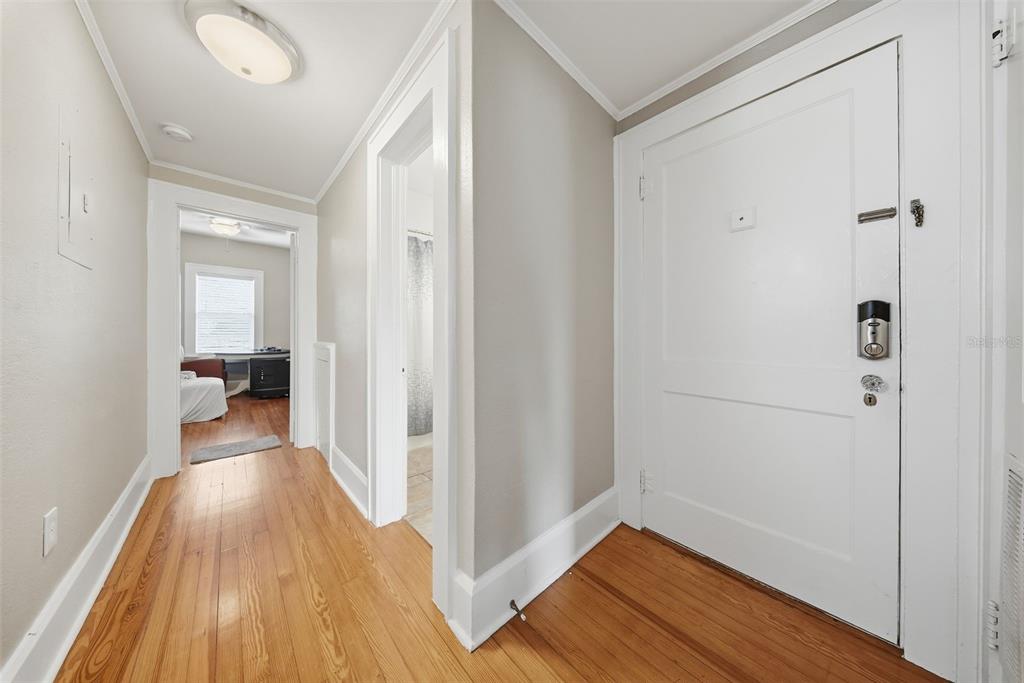 8334 Diagonal Road North St. Petersburg, FL 33702 - Photo 34 of 57 a view of a hallway with wooden floor and a bathroom