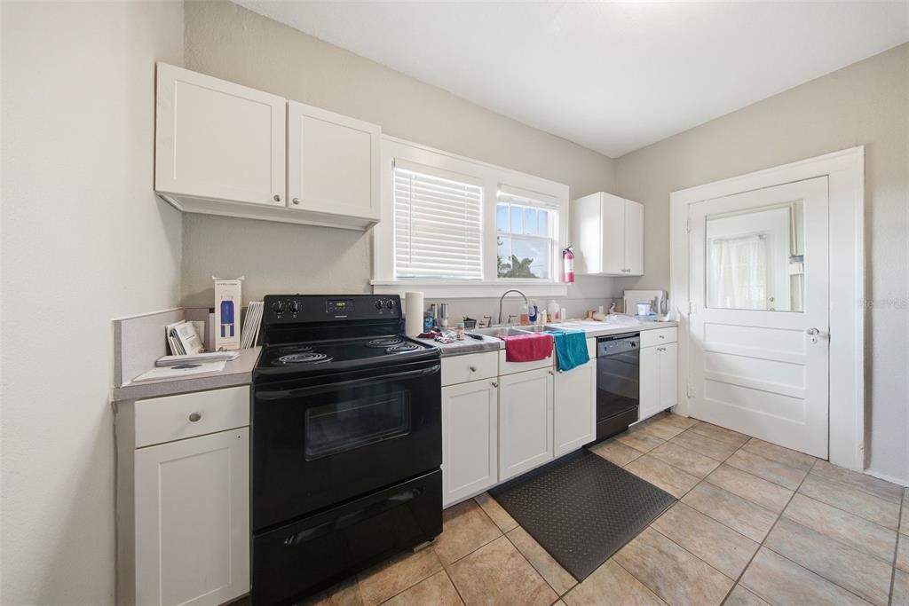 8334 Diagonal Road North St. Petersburg, FL 33702 - Photo 35 of 57 a kitchen with a stove top oven and cabinets