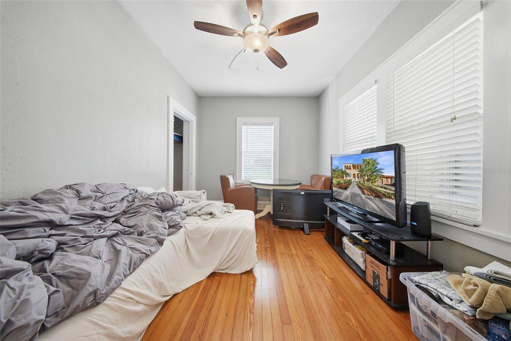 8334 Diagonal Road North St. Petersburg, FL 33702 - Photo 37 of 57 a bedroom with furniture and a flat screen tv