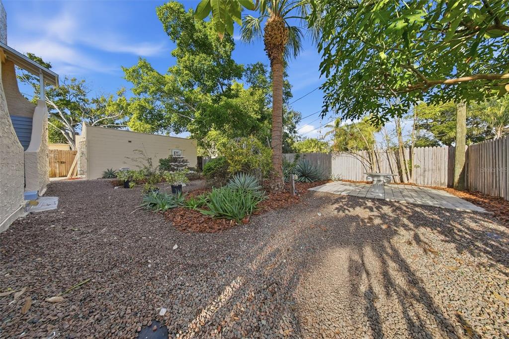 8334 Diagonal Road North St. Petersburg, FL 33702 - Photo 43 of 57 a backyard of a house with lots of green space