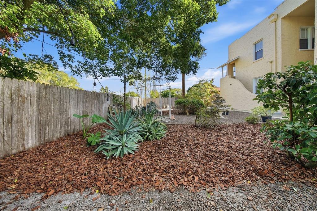 8334 Diagonal Road North St. Petersburg, FL 33702 - Photo 47 of 57 a backyard of a house with lots of green space