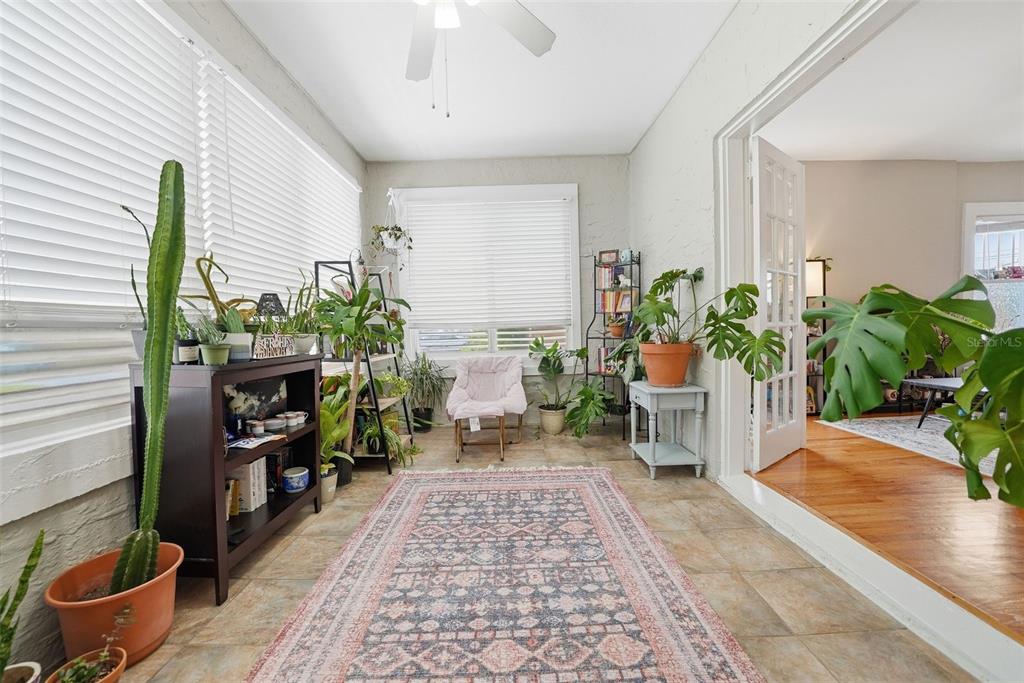 8334 Diagonal Road North St. Petersburg, FL 33702 - Photo 5 of 57 a living room with furniture and potted plants