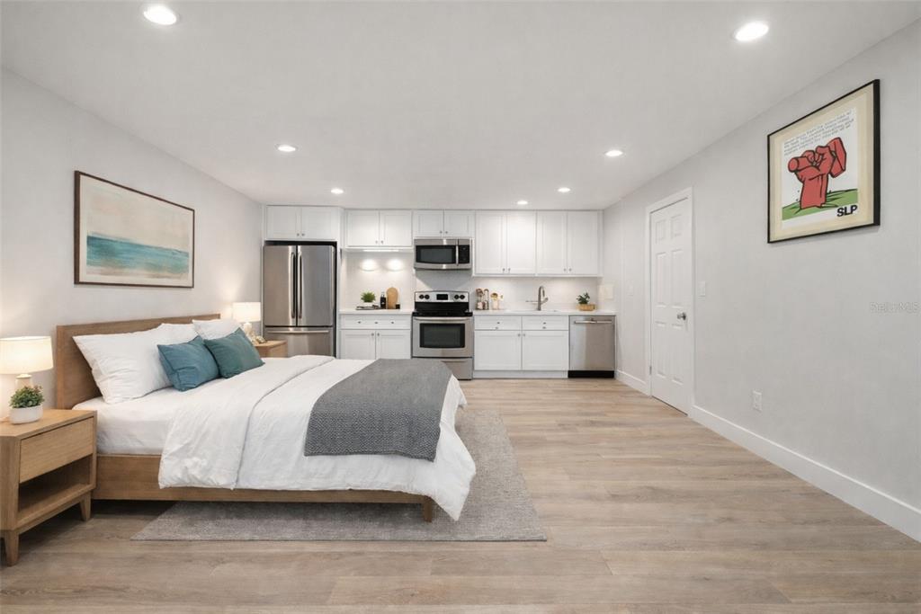 8334 Diagonal Road North St. Petersburg, FL 33702 - Photo 55 of 57 a spacious bedroom with a bed and a large mirror