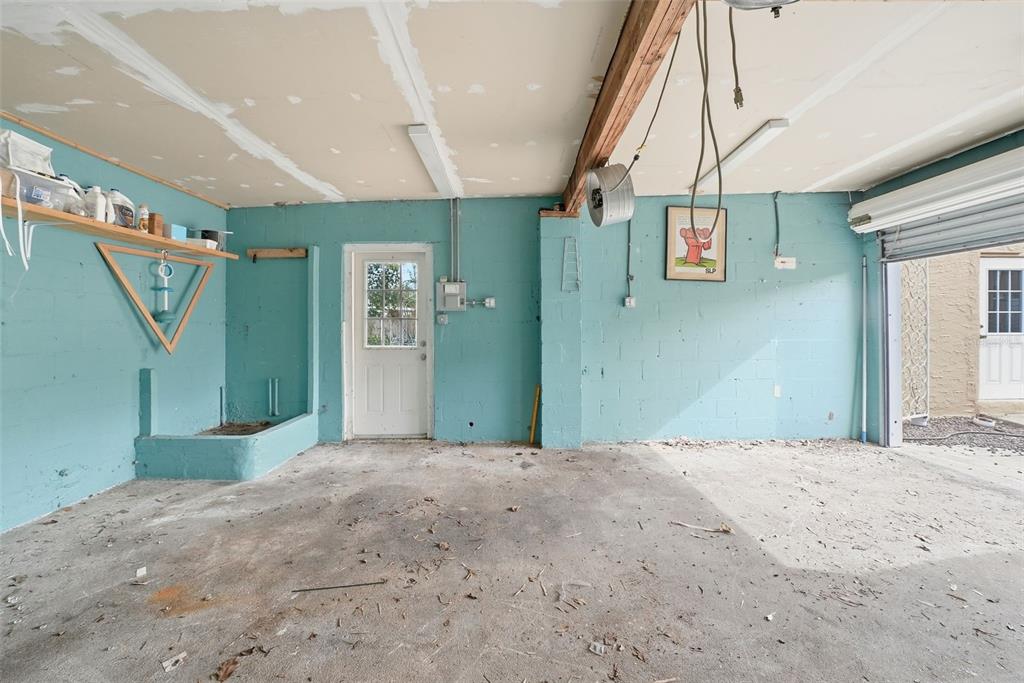 8334 Diagonal Road North St. Petersburg, FL 33702 - Photo 57 of 57 a view of a big room with staircase and door