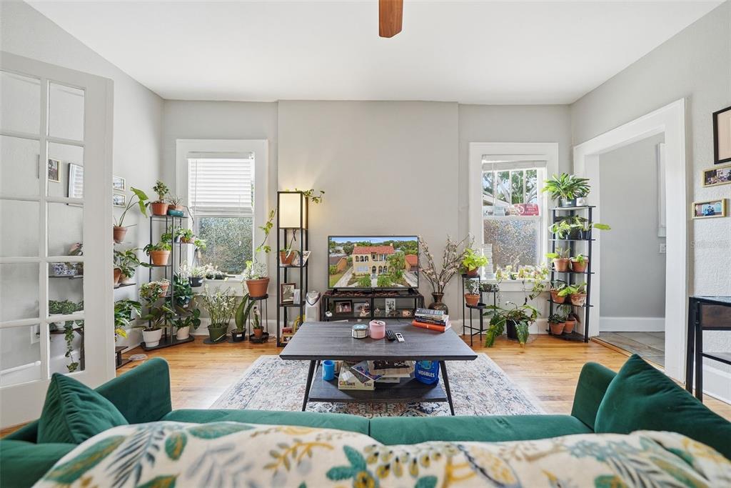 8334 Diagonal Road North St. Petersburg, FL 33702 - Photo 7 of 57 a living room with furniture and wooden floor