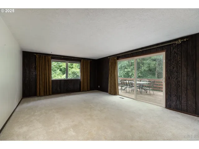 a view of empty room with front door