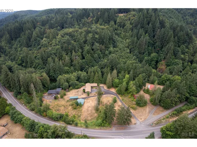 a view of a wooden house with a yard
